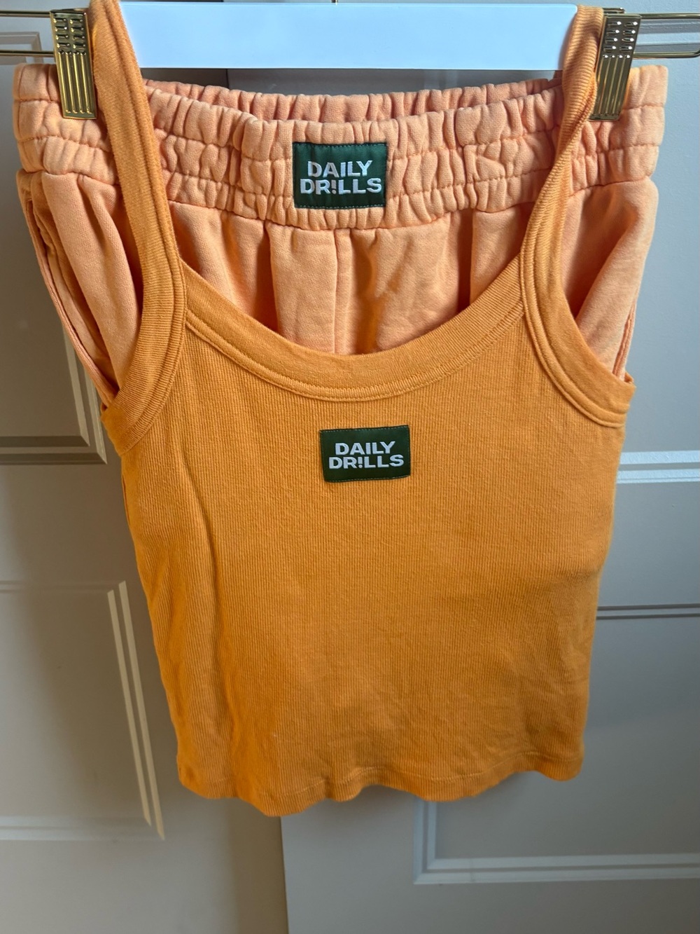 Daily Drills Women's Orange Ribbed Tank Top and matching shorts